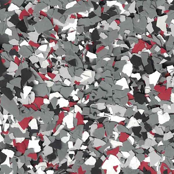 The image shows a collection of irregularly shaped fragments in shades of gray, black, white, and red, scattered densely to create a textured appearance.