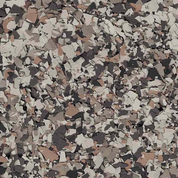 The image displays a textured surface with a mosaic of various shades of gray, brown, and white, resembling an abstract, fragmented pattern.