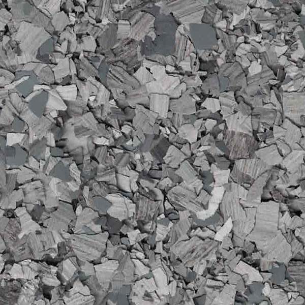 The image shows a heap of crushed stone, with varied shades of gray and irregular edges, likely construction aggregate or road-building material.
