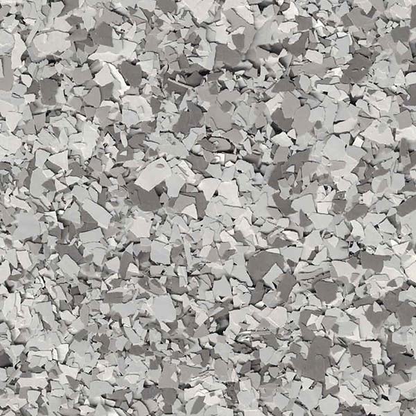 The image displays a large collection of small, broken gray pieces scattered chaotically, creating a texture that could resemble crushed stone or shattered material.