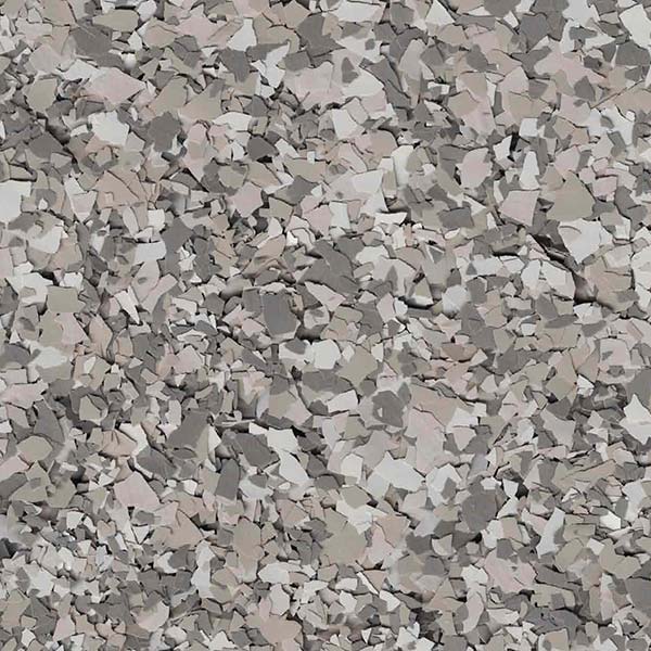 The image displays a textured pattern of various shades of gray, resembling a pile of irregularly shaped stones or abstract mosaic pieces clustered closely together.