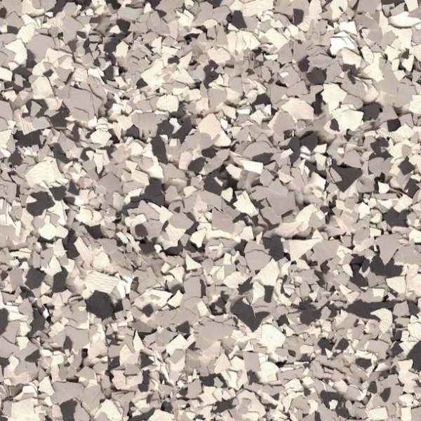 The image displays a densely packed collection of irregularly shaped fragments in various shades of gray, resembling a chaotic pattern of shattered material.