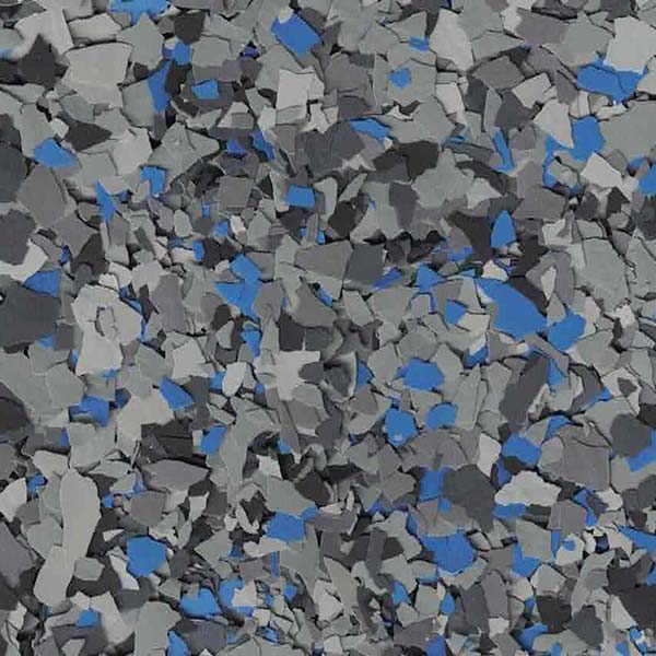 This image features an array of scattered, jagged fragments in varying shades of gray, blue, and black, resembling a chaotic pattern of broken objects or materials.