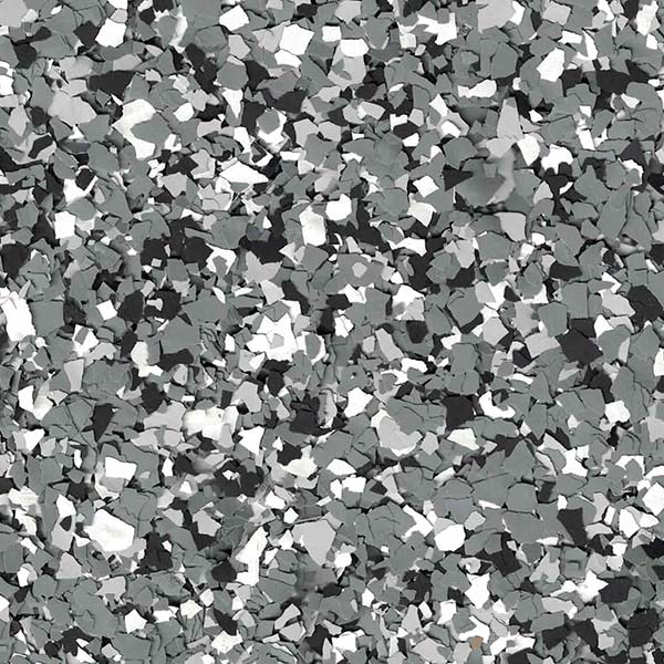 The image shows a chaotic assortment of variously sized, jagged grey and white fragments distributed over the entire surface, resembling broken stone or metal pieces.