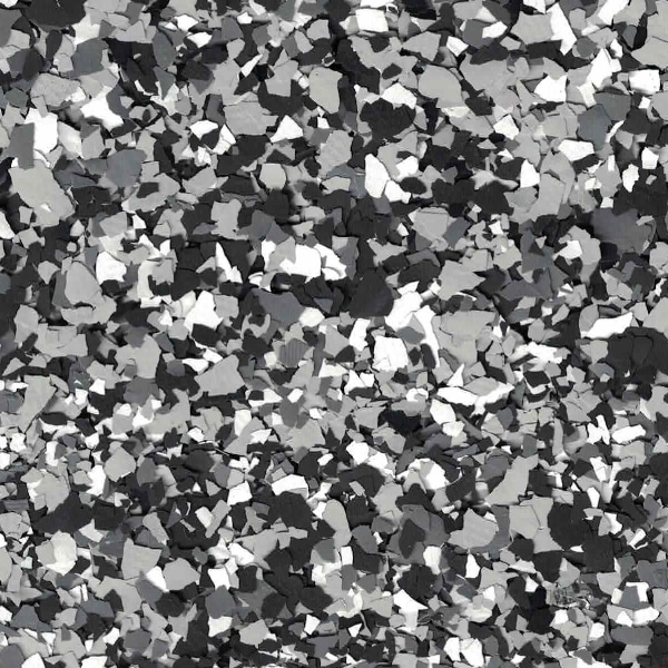 The image shows a pattern of scattered confetti-like shapes in different shades of gray, black, and white, creating a textured, monochromatic mosaic effect.